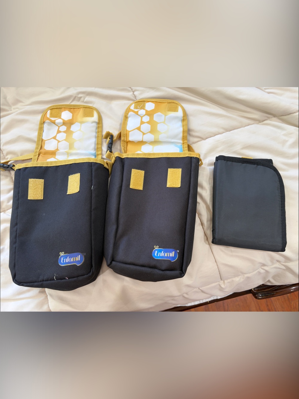 Two Enfamil milk bags/ Accessory Pouch. And a diaper changing pad brand new.